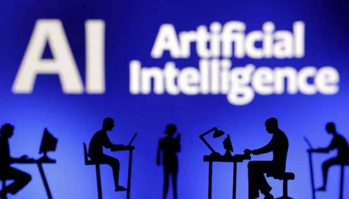 Figurines with computers and smartphones are seen in front of the words Artificial Intelligence AI in this illustration taken, on February 19, 2024. — Reuters