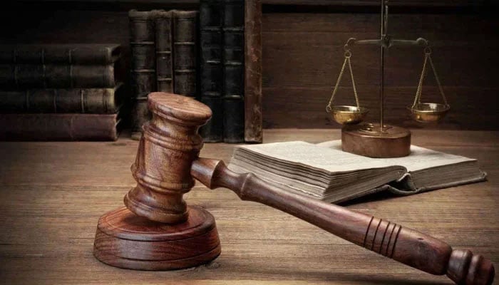 The representational image shows a gavel and a balance. —Unsplash/File