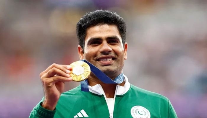Gold medallist Arshad Nadeem of Pakistan celebrates with his medal on the podium after winning gold at the Paris 2024 Olympics. —Reuters/File